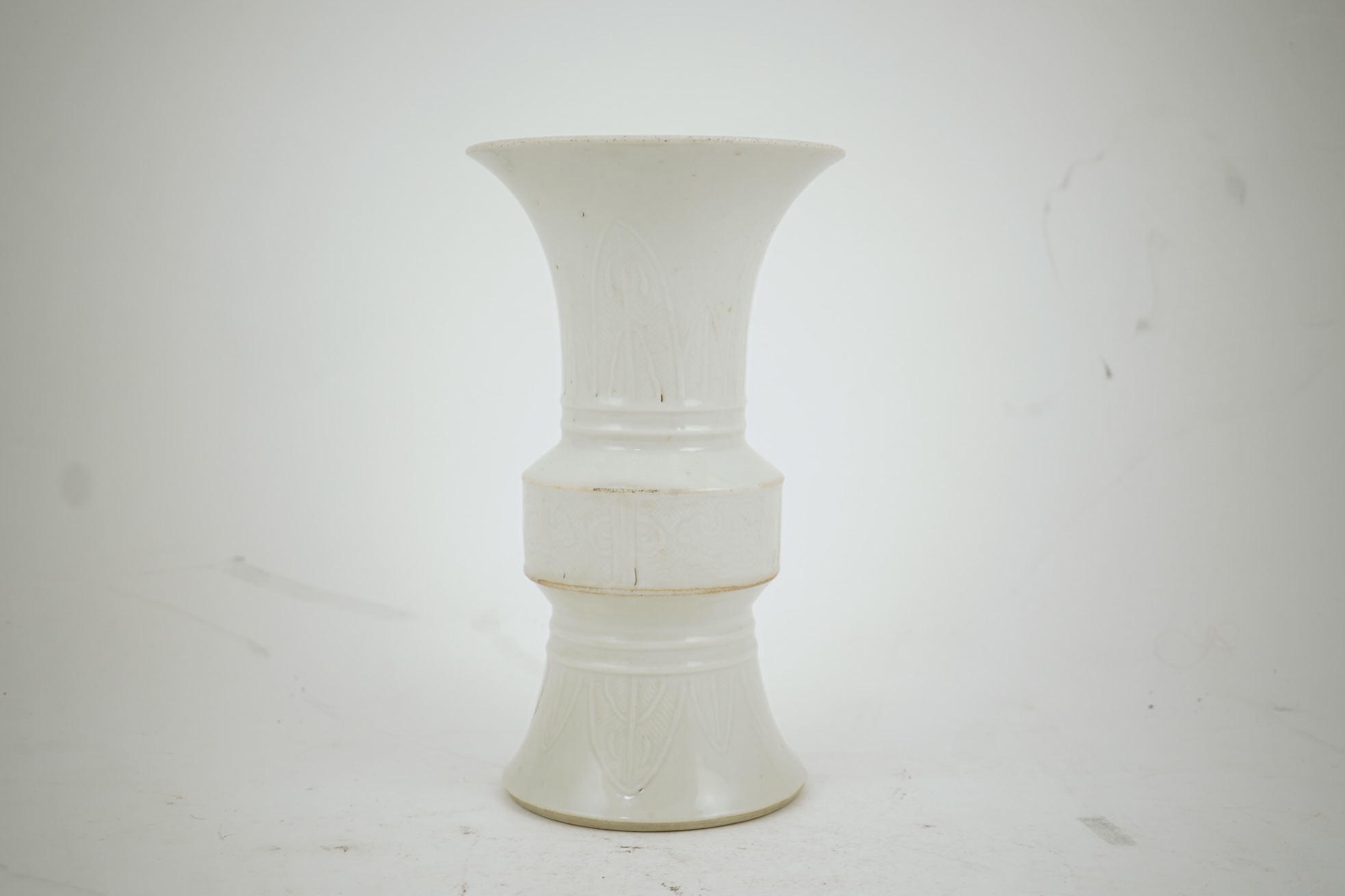 A Chinese white glazed 'gu' vase, 19th century